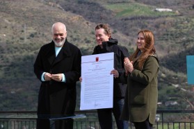 Prime Minister Edi Rama, Patagonia CEO Ryan Gellert, and Minister for Tourism and Environment Mirela Kumbaro, holding the just signed official declaration of Vjosa Wild River National Park.